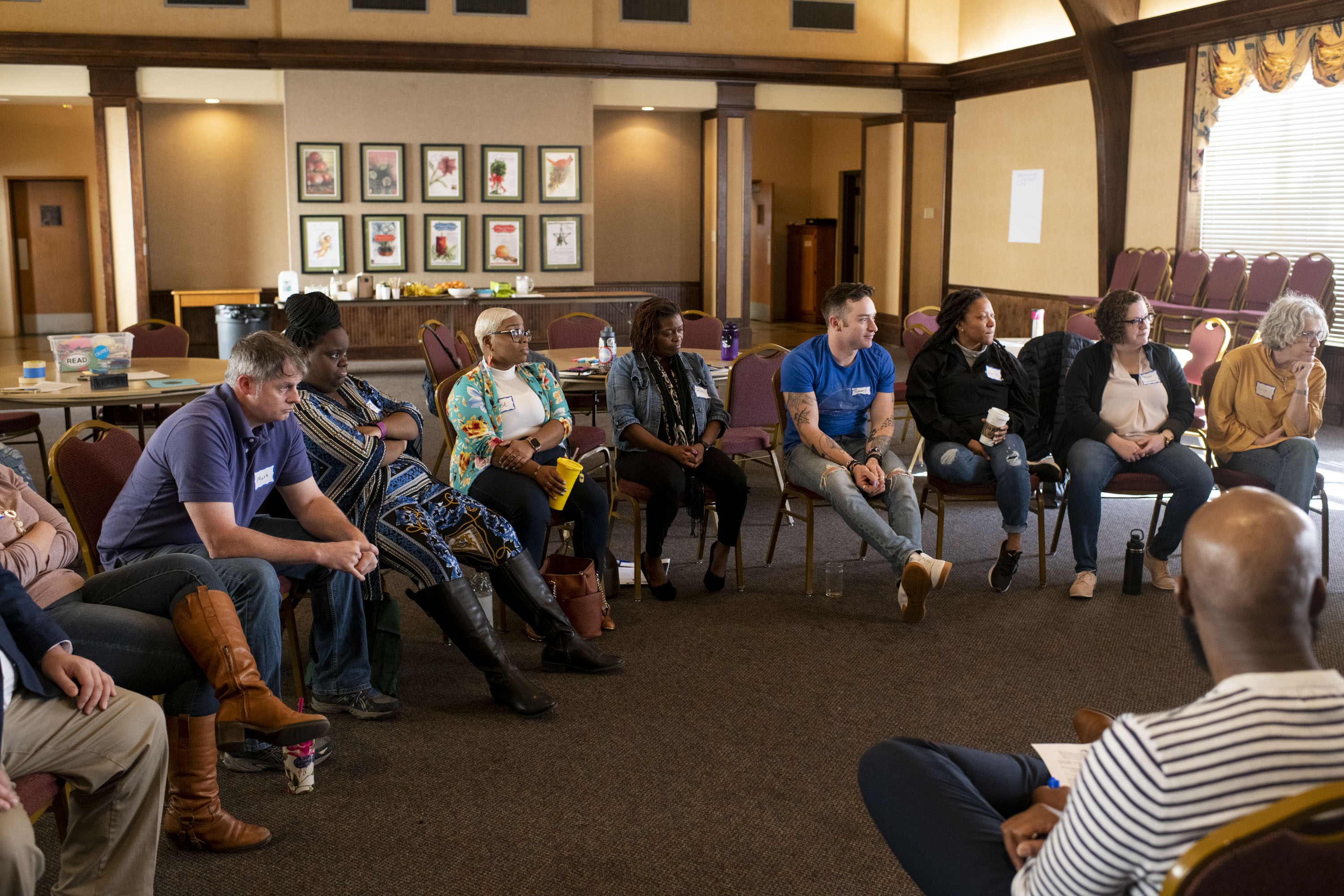 Group of people sitting and listening to each other